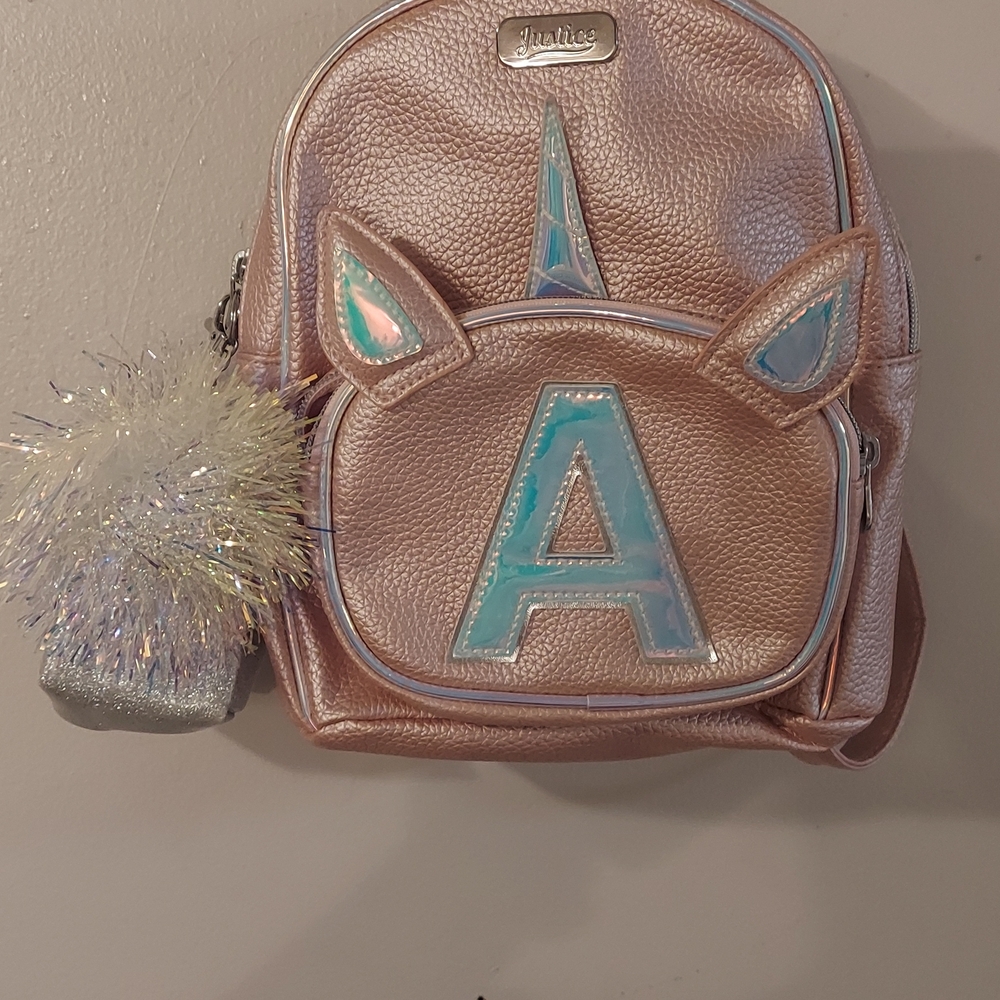 Justice Unicorn Backpack NWOT with Pom Pom "A" front, with attachable pouch.